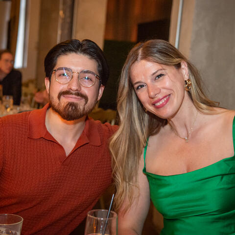 Two attendees are photographed enjoying the event at the 2025 Quebec Grand Finale, Place Viger Montreal.