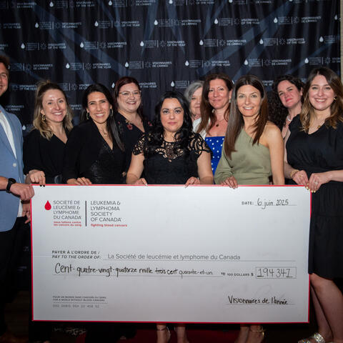 LLSC Staff are pictured with the CQ announcing the Grand Total Raised of $194,347 at the 2025 Quebec Grand Finale, Place Viger Montreal.