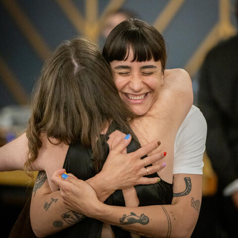 Attendees embrace that the 2025 Quebec Grand Finale, Place Viger Montreal.