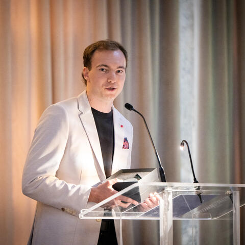 Honoured Hero Simon Robitaille delivers a speech from the stage at the 2025 Quebec Grand Finale, Place Viger Montreal.