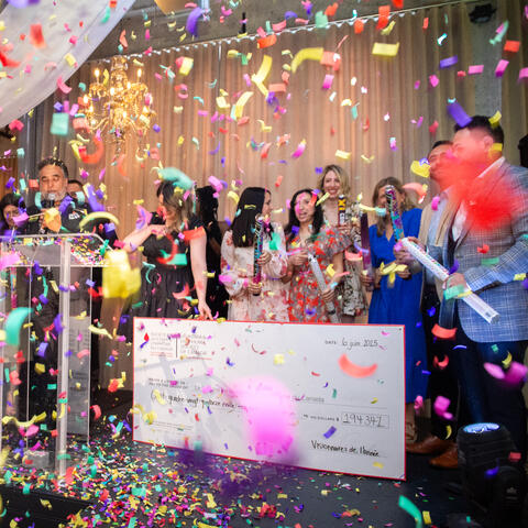 2025 Candidate Class is photographed on stage celebrating the Grand Total announcement of $194,347 at the 2025 Quebec Grand Finale, Place Gare Viger Montreal.