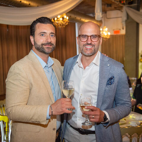 Attendees are photographed sharing a drink at the 2025 Quebec Grand Finale, Place Gare Viger Montreal.