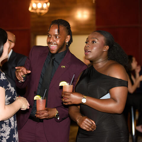 Attendees share a drink at the Atlantic Grand Finale, Steele Wheels Auto Museum in Halifax.