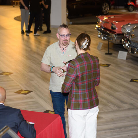 Attendees checkin for arrival at the Atlantic Grand Finale, Steele Wheels Auto Museum in Halifax.