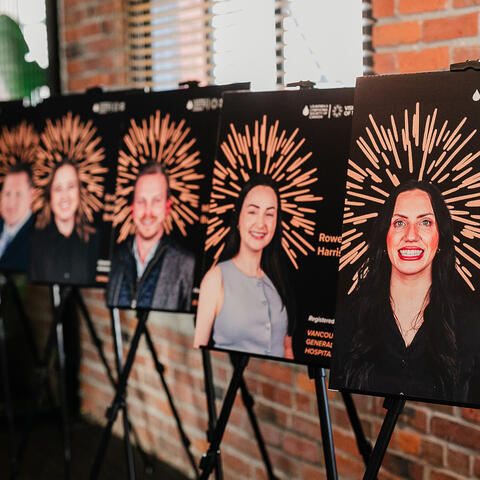 Candidate posters line the venue walls, celebrating participants supporting blood cancer research at the gala event.