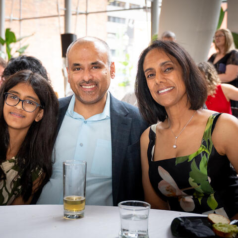 Participants and attendees engage during a fundraising event, connecting and celebrating together in the event space.