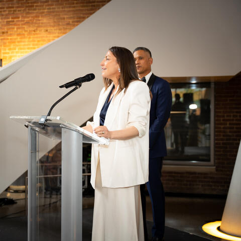 Participants and attendees engage during a fundraising event, connecting and celebrating together in the event space.